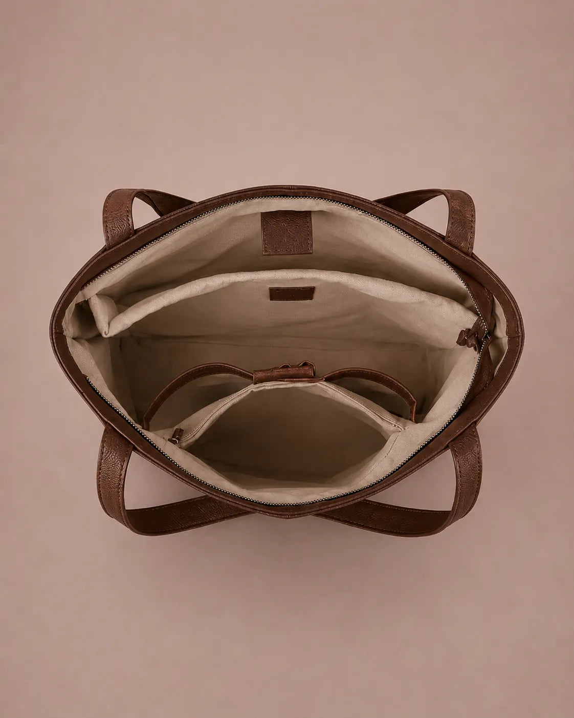 Interior of The Eleanor genuine leather tote bag in Brown featuring organised compartments, zip closure and spacious storage for everyday essentials.