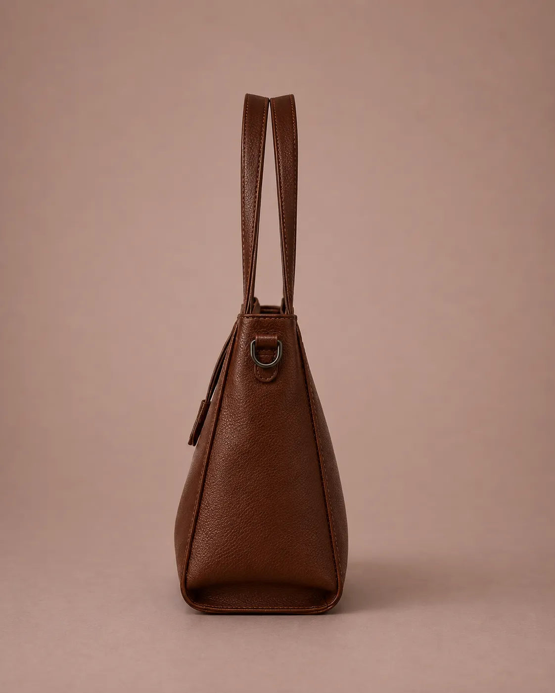 Side view of The Eleanor genuine leather tote bag in Brown highlighting its structured profile, generous capacity and elegant everyday design.