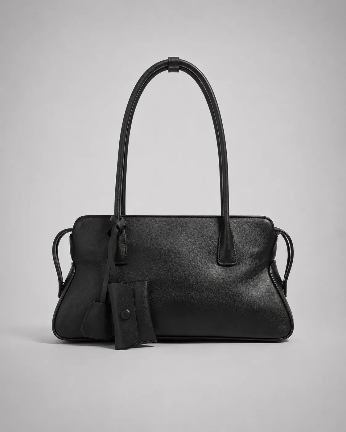 Georgia leather shoulder bag in Black genuine leather front view featuring a soft structured silhouette, double shoulder straps, decorative leather charms and secure zip-top closure from the Soft Structure collection by Malena London.