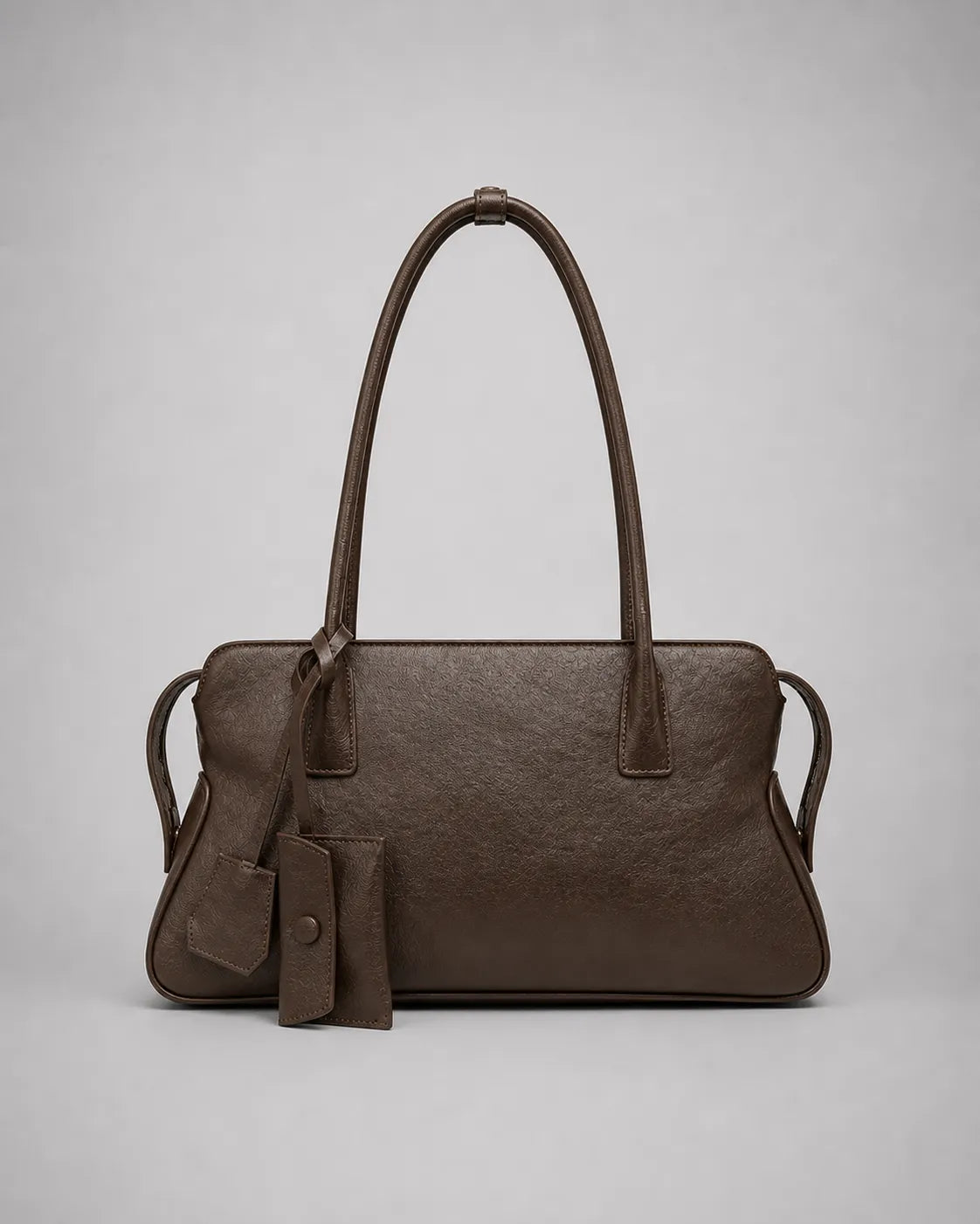 Georgia leather shoulder bag in Dark Chocolate genuine leather front view featuring a soft structured silhouette, double shoulder straps, decorative leather charms and zip-top closure from the Soft Structure collection by Malena London.