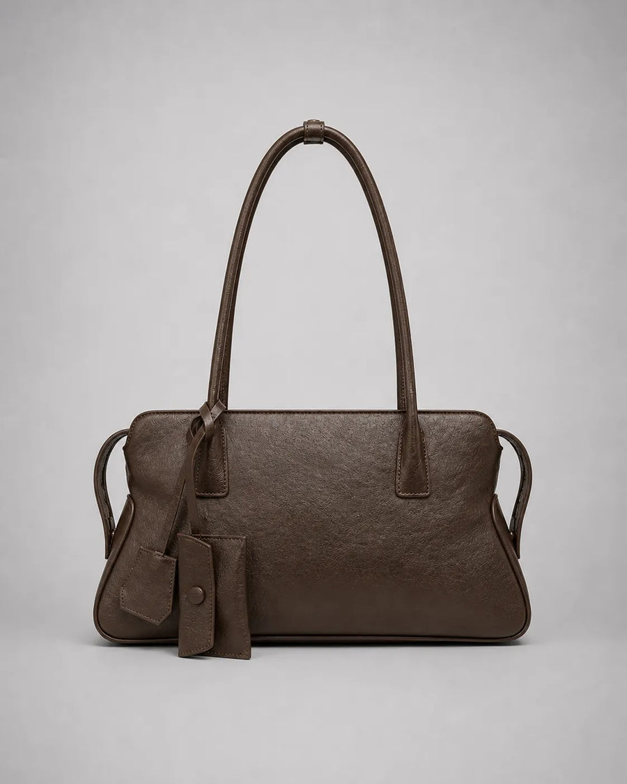 Georgia leather shoulder bag in Dark Chocolate genuine leather front view featuring a soft structured silhouette, double shoulder straps, decorative leather charms and zip-top closure from the Soft Structure collection by Malena London.