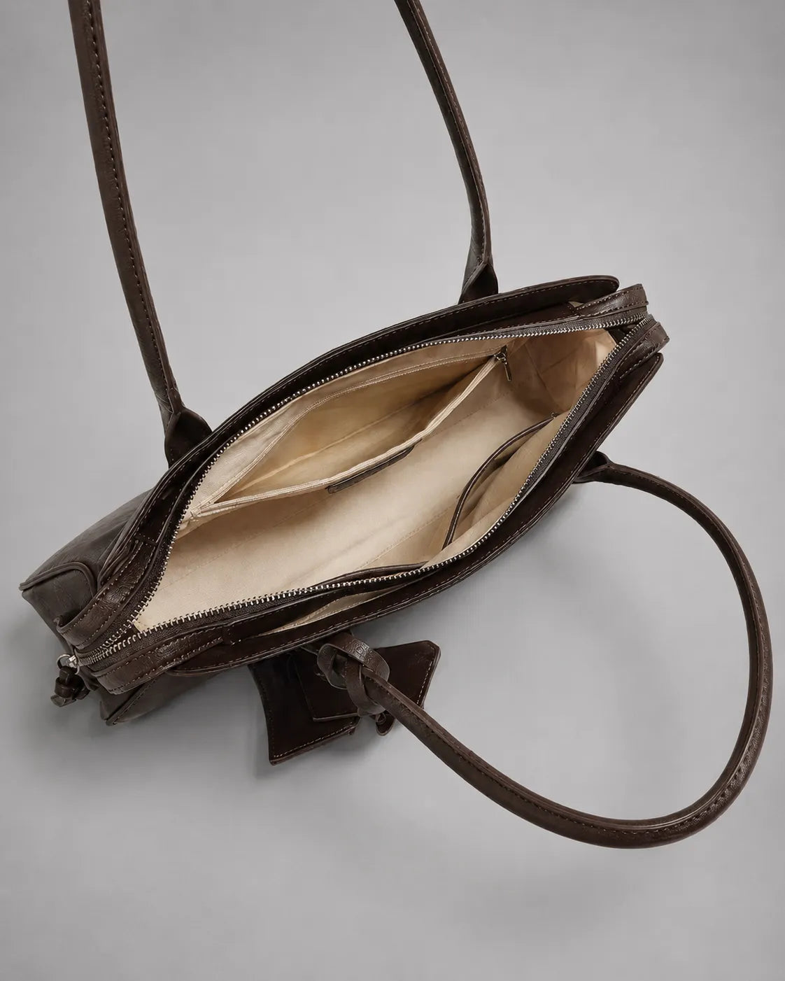 Georgia leather shoulder bag in Dark Chocolate genuine leather interior view showcasing the spacious main compartment, zippered pocket, document organiser, premium lining and practical everyday storage from the Soft Structure collection by Malena London.