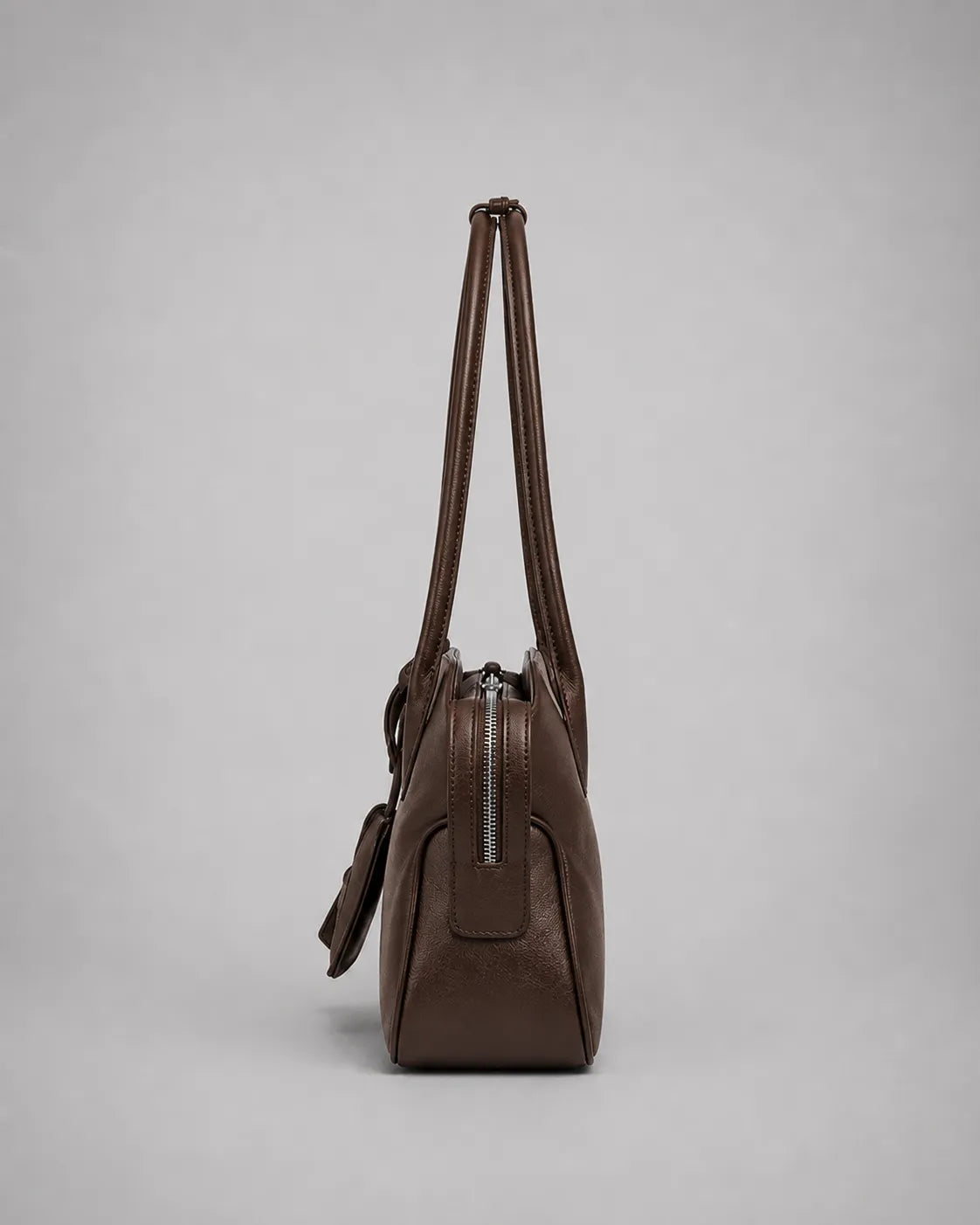 Georgia leather shoulder bag in Dark Chocolate genuine leather side view displaying the slim profile, zip-top closure, soft structure and comfortable shoulder carry design from the Soft Structure collection by Malena London.