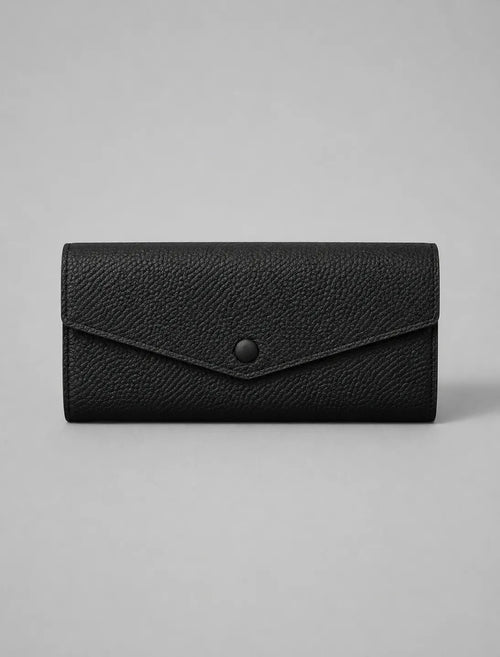 Leather Envelope Wallet in Black genuine leather featuring an elegant envelope flap design, textured leather finish and snap button closure. Women's leather wallet by Malena London.