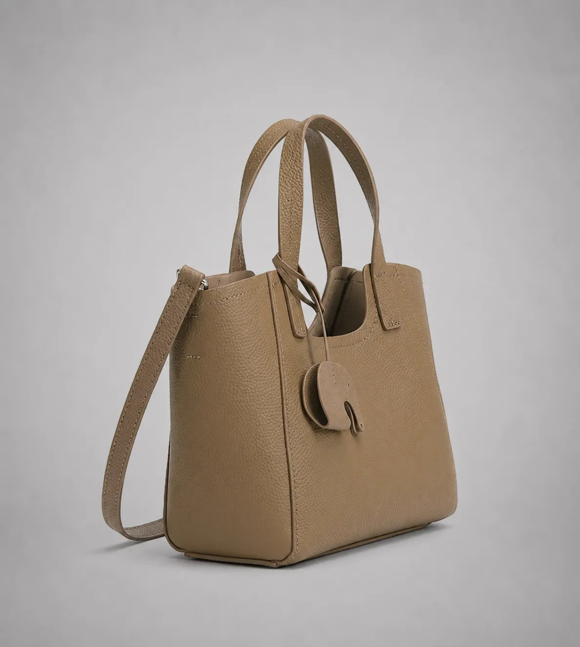 Louise leather tote bag in elephant grey genuine leather with detachable shoulder strap and structured design, side angle view