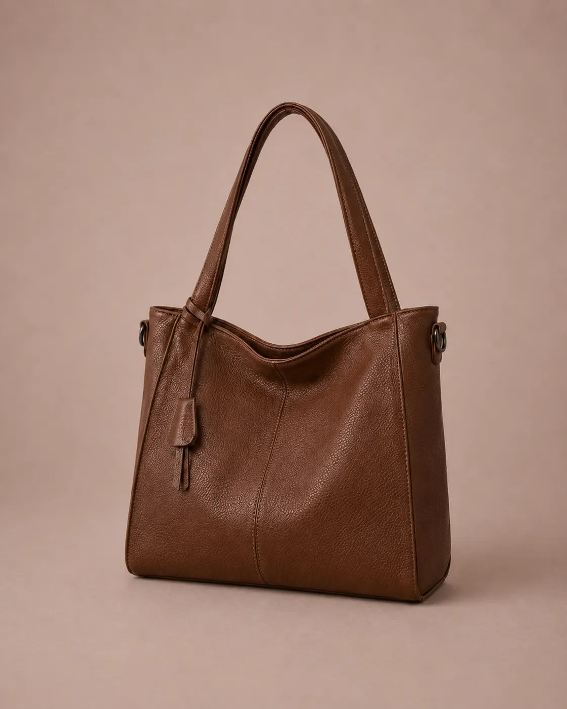 Front angled view of The Eleanor luxury genuine leather tote bag in Brown with a soft structured silhouette and elegant everyday design.