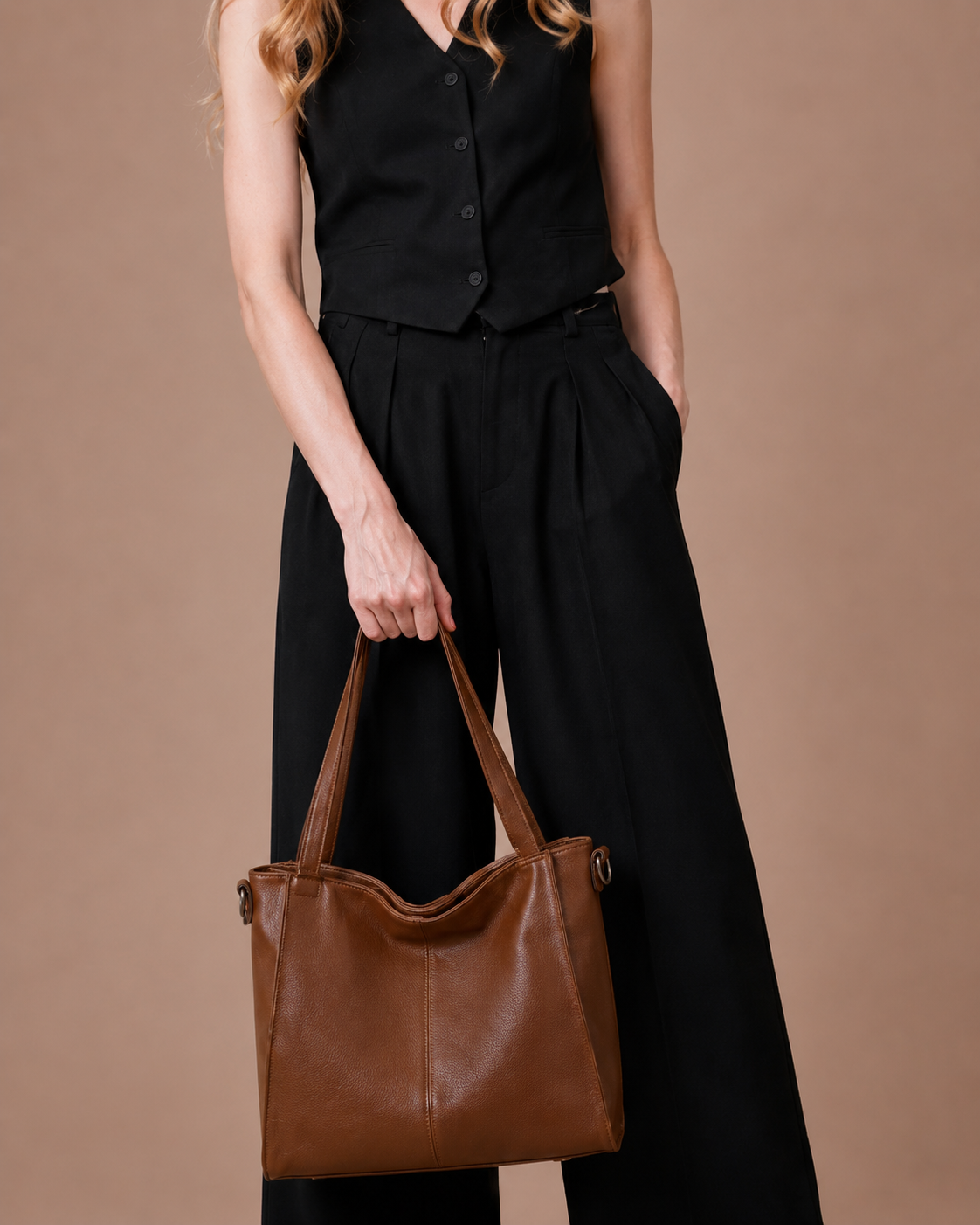 Lifestyle image of the Eleanor large genuine leather tote bag in Brown. Elegant shoulder bag crafted from premium leather with a spacious interior, perfect for office essentials, commuting and modern everyday style.