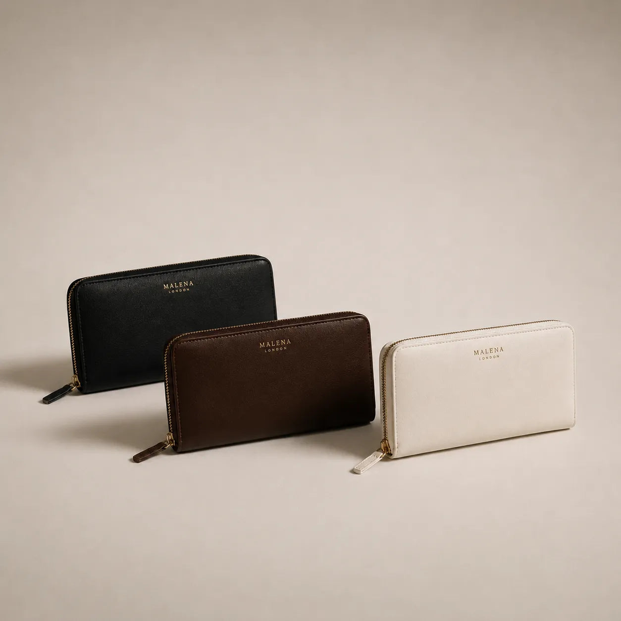 Premium leather wallets in black, dark chocolate and cream designed to complement women's handbags by Malena London