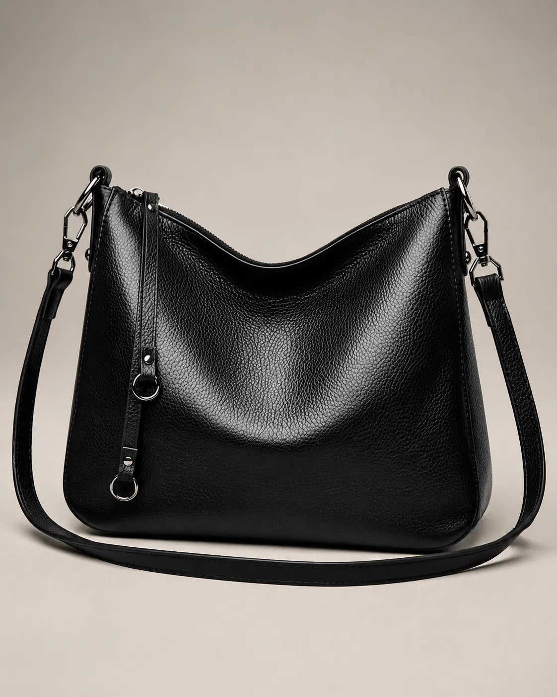 Front view of the Noémie soft genuine leather hobo shoulder bag in black showing the relaxed silhouette and double straps.