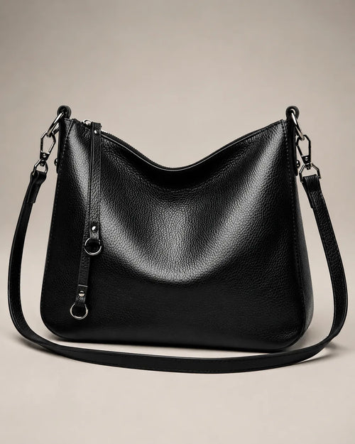 Front view of the Noémie soft genuine leather hobo shoulder bag in black showing the relaxed silhouette and double straps.