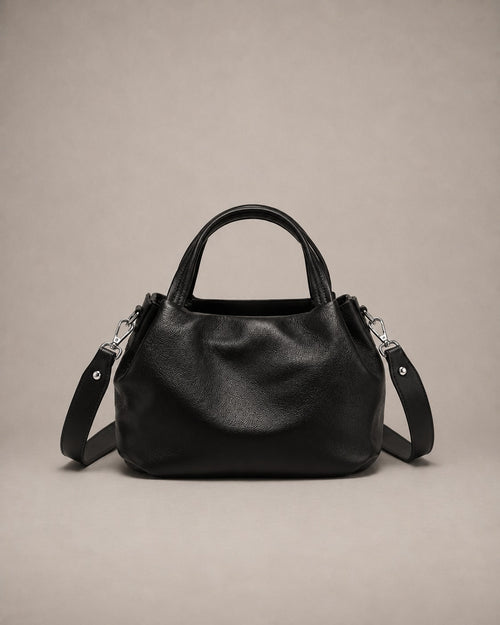 Front view of the Pauline genuine leather top handle crossbody bag in Black featuring soft pebbled leather, a structured silhouette and an adjustable shoulder strap by Malena London.