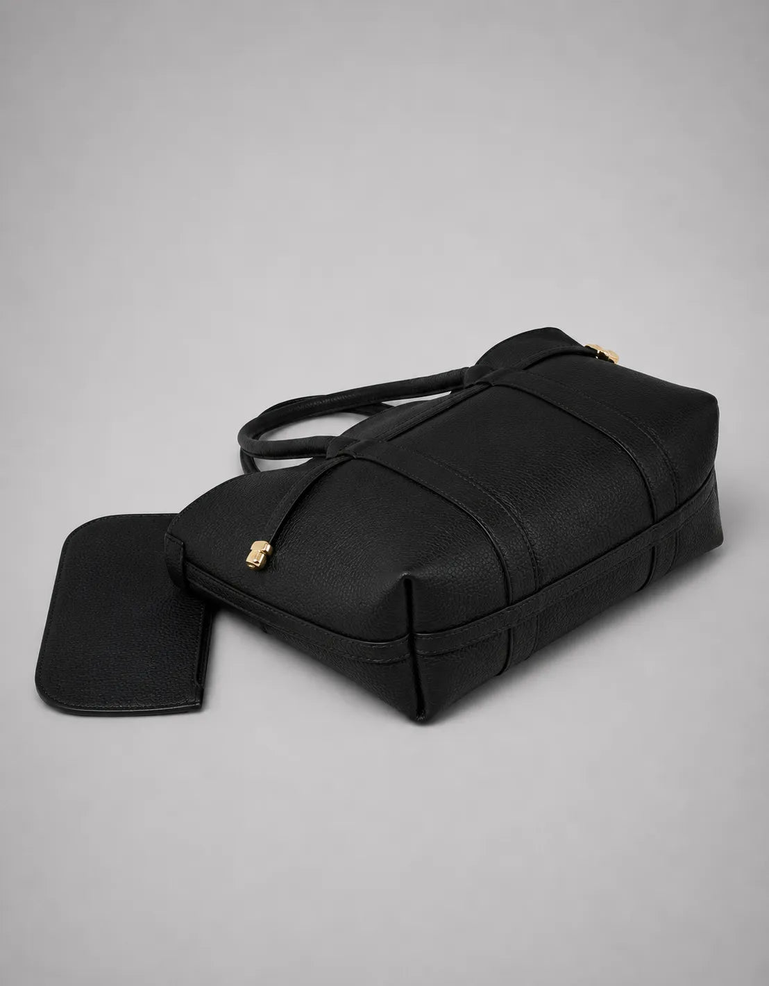 Bottom view of the Rose Leather Tote Bag in Black genuine leather, showcasing its structured base, premium craftsmanship and spacious everyday design.