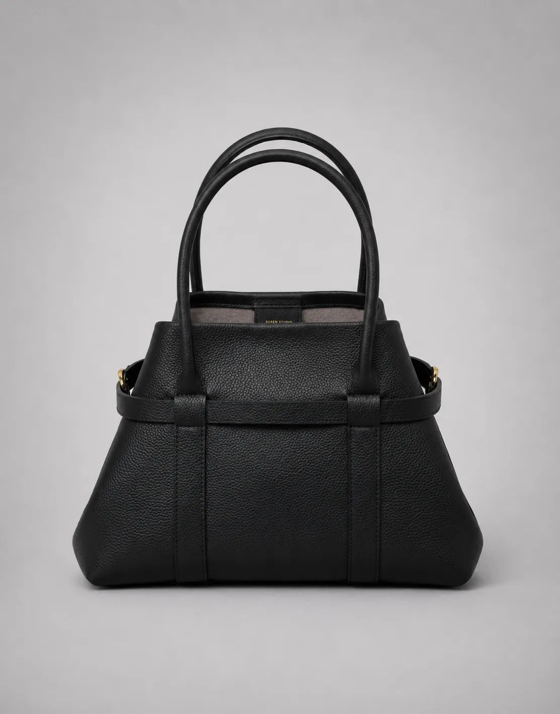 Rose Leather Tote Bag in Black genuine leather with side hardware secured, creating a refined structured silhouette while maintaining its spacious interior design.