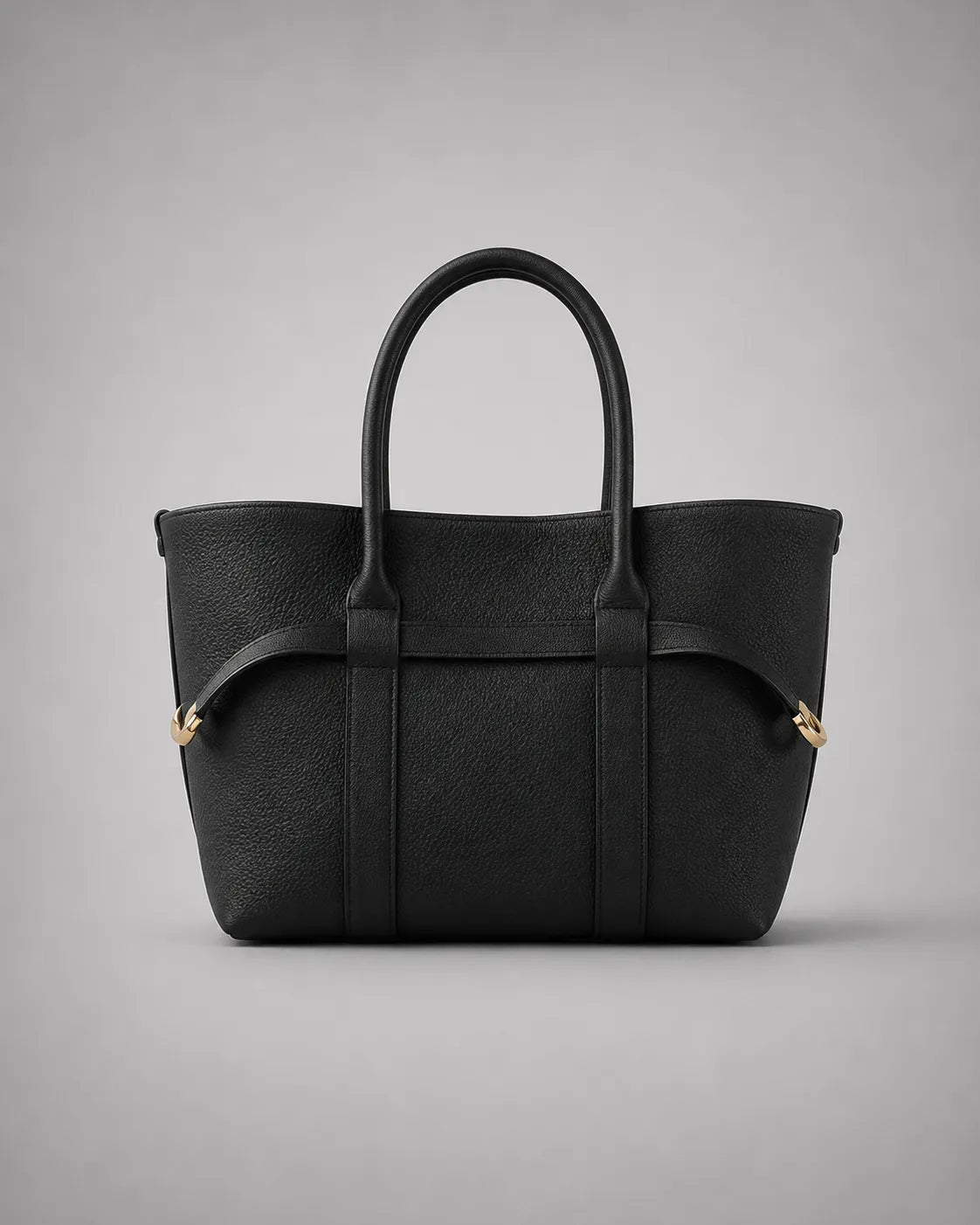 Rose Leather Tote Bag in Black genuine leather shown from the front, featuring a structured silhouette, double top handles and refined gold-tone hardware from The City Edit by Malena London.
