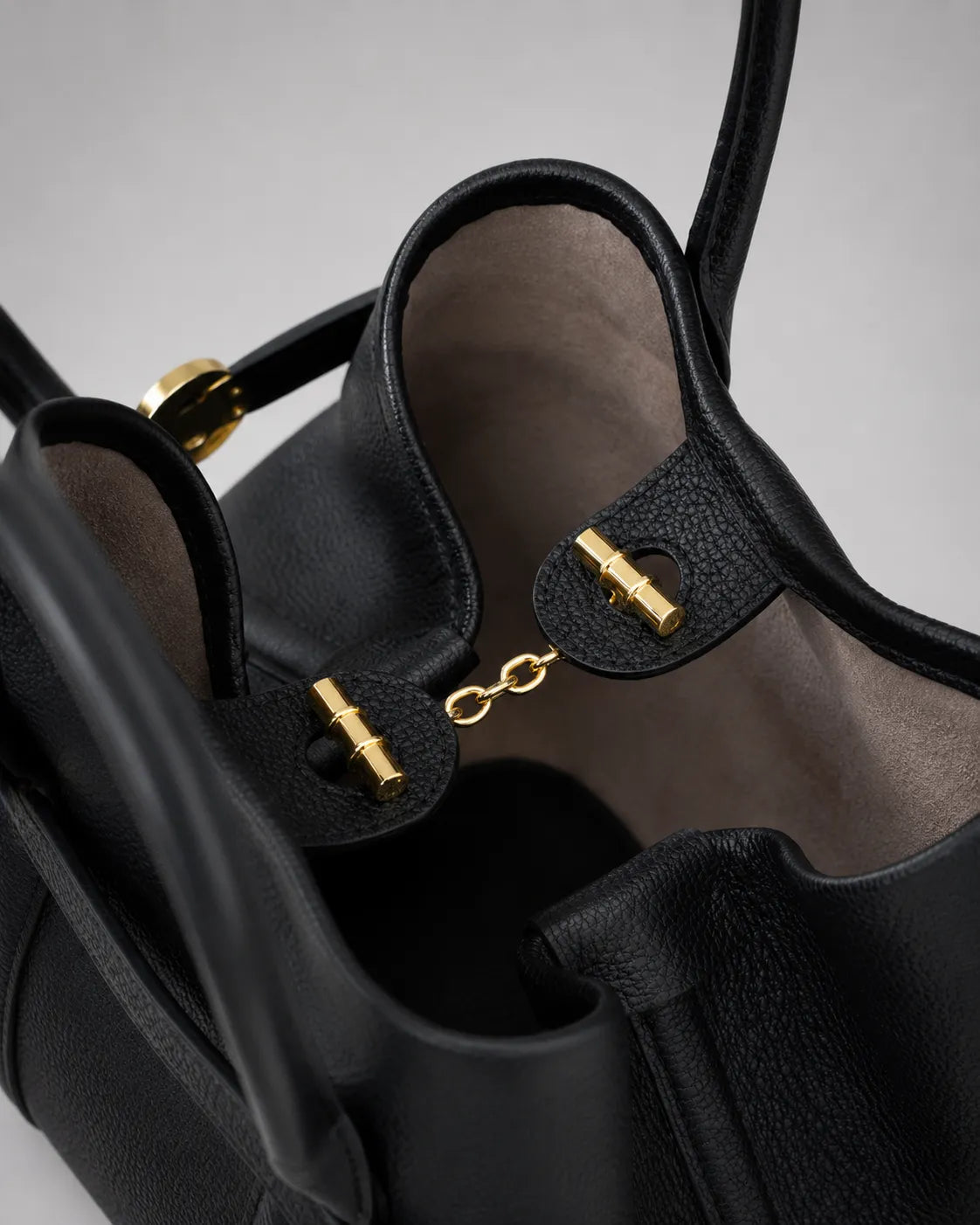 Interior detail of the Rose Leather Tote Bag in Black genuine leather, showcasing the premium lining, spacious compartment and elegant gold-tone closure hardware.