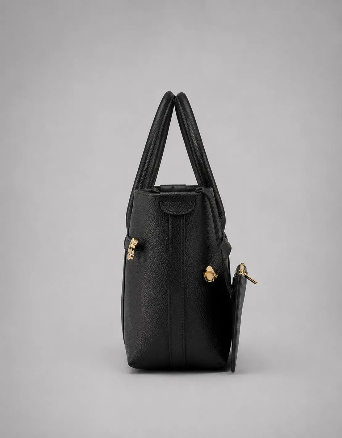 Rose Leather Tote Bag in Black genuine leather shown from the side, highlighting its structured profile, generous depth and sophisticated city-ready silhouette.
