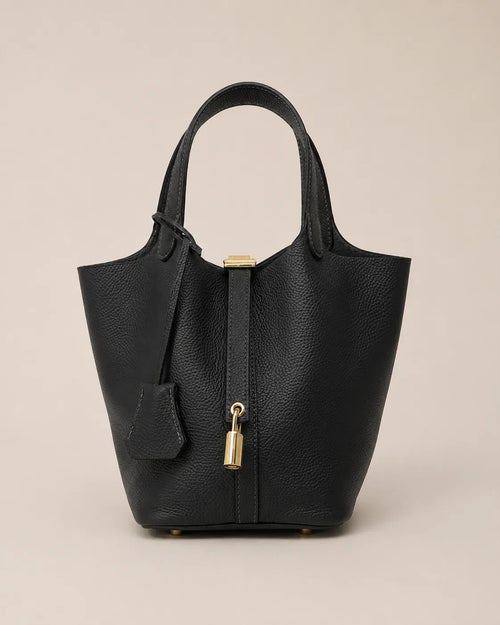 Front view of Scarlett genuine leather bucket tote bag in black leather with signature lock detail and structured silhouette