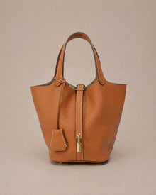 Scarlett genuine leather bucket tote bag in brown leather front view with premium pebbled texture and elegant bucket silhouette