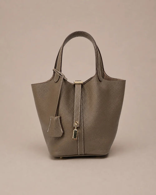 Scarlett genuine leather bucket tote bag in dark gray leather front view with signature lock closure and minimalist design