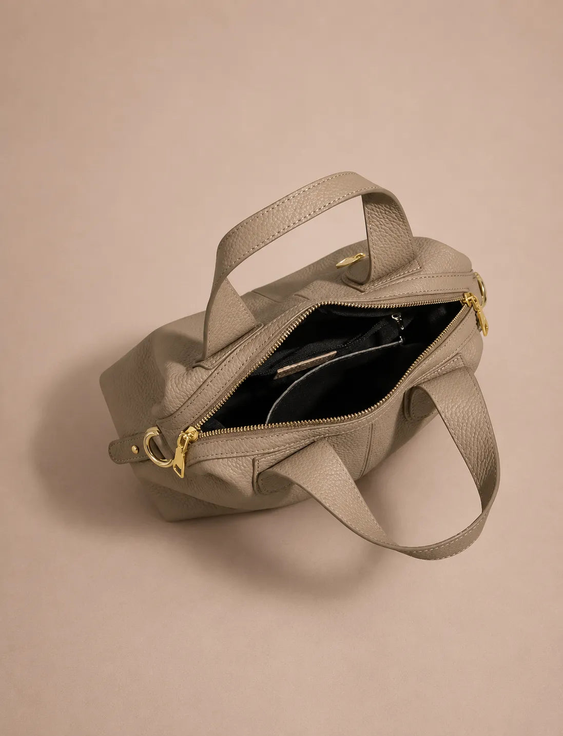 Top open view of the Victoire leather dumpling bag in Elephant Gray genuine leather showcasing the spacious interior, secure zip closure, organised compartments, premium lining and refined craftsmanship from Malena London.