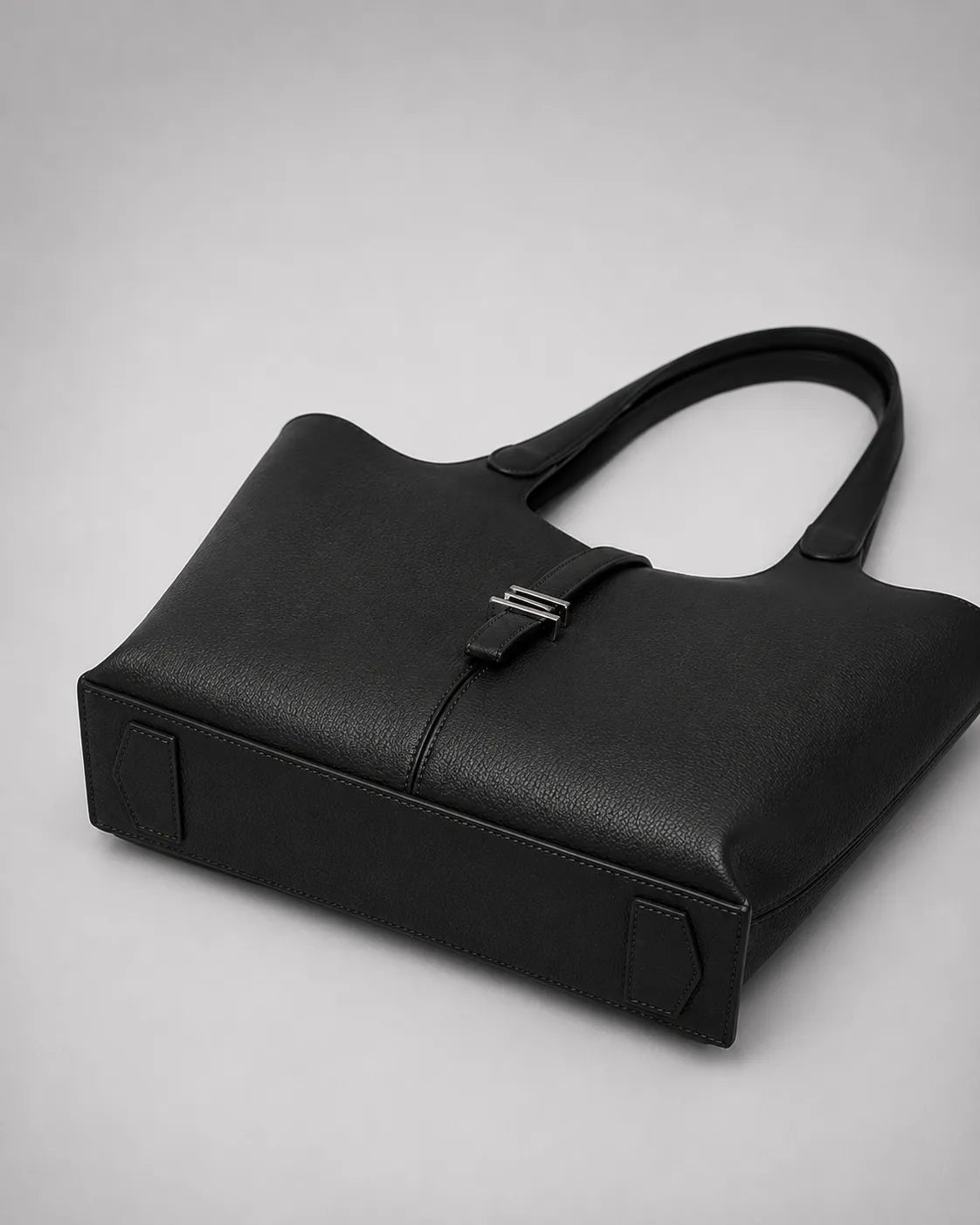 Bottom view of the Victoria genuine leather work tote bag in black, highlighting the structured base, durable construction and spacious tote silhouette.