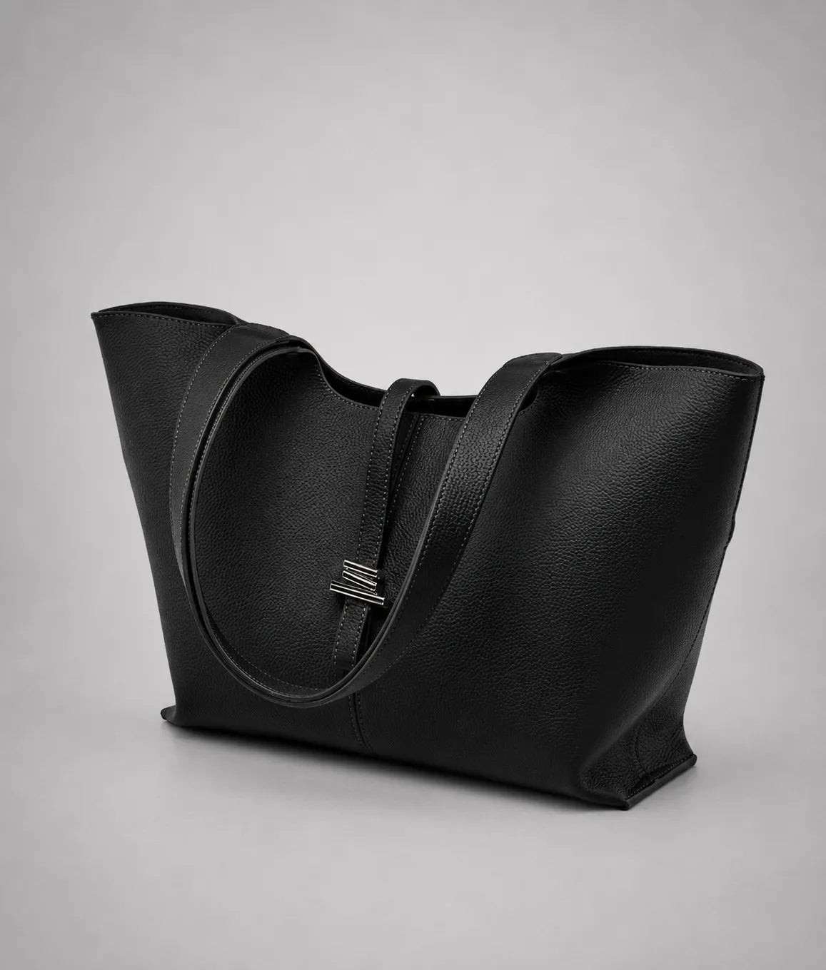 Front detail view of the Victoria genuine leather work tote bag in black, showcasing the spacious tote silhouette, long shoulder straps and sophisticated design for commuting and everyday use.