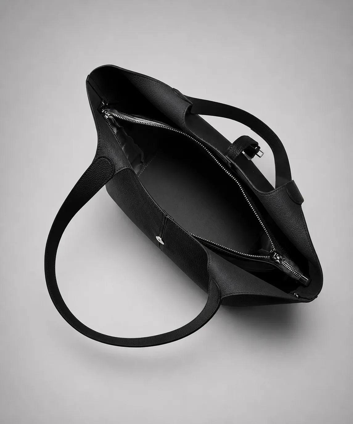 Interior view of the Victoria genuine leather work tote bag in black, showing the spacious compartment, secure zip section and organised storage for daily essentials.