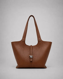 Victoria genuine leather work tote bag in brown displayed from the front, featuring a spacious silhouette, long shoulder straps and a timeless design for work and everyday use.