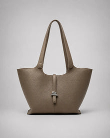 Victoria genuine leather work tote bag in Elephant Gray displayed from the front, featuring a spacious silhouette, elegant shoulder straps and a sophisticated city-inspired design.