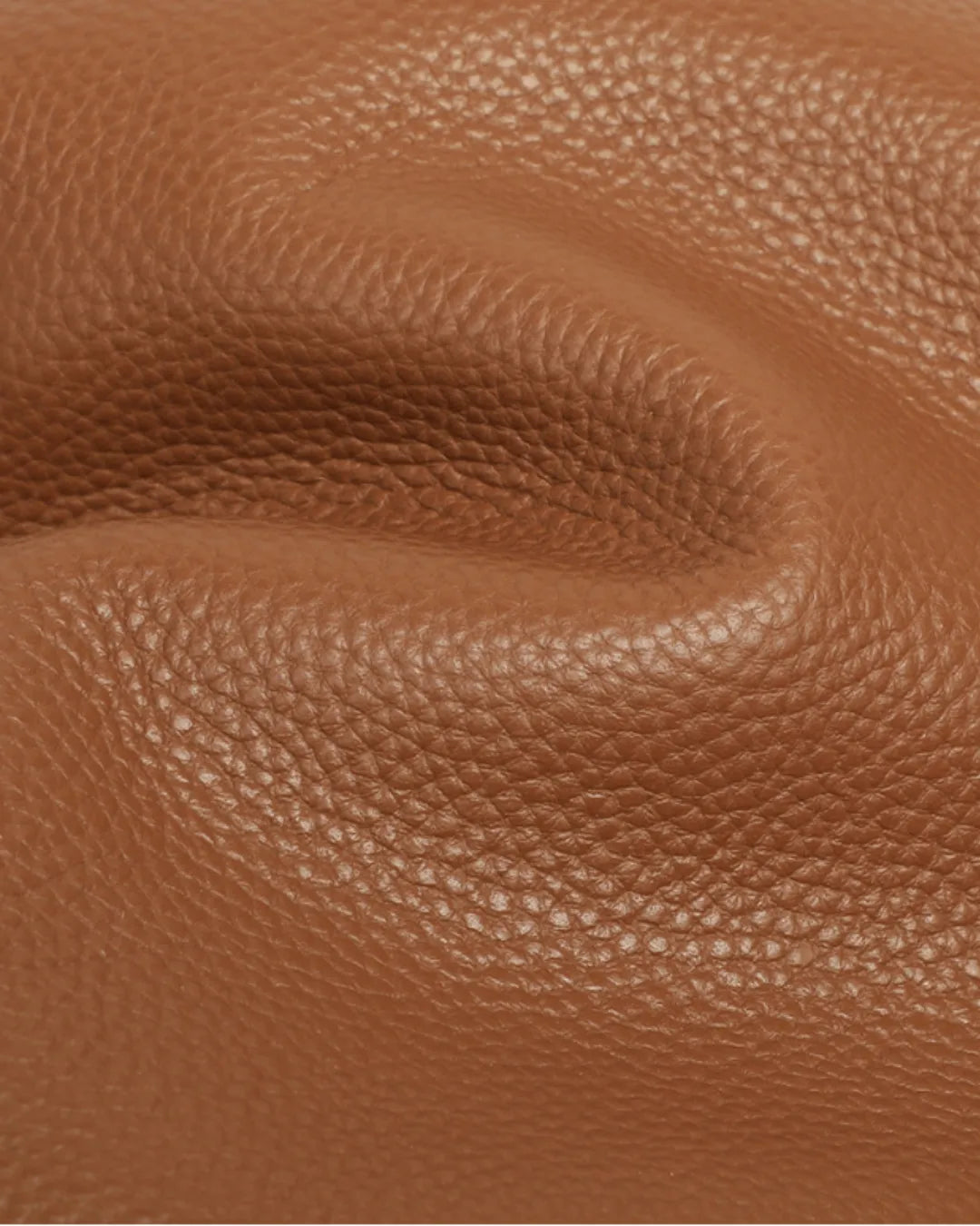 Close-up of The Viney genuine Brown leather showcasing the natural grain texture and premium first-layer cowhide finish.