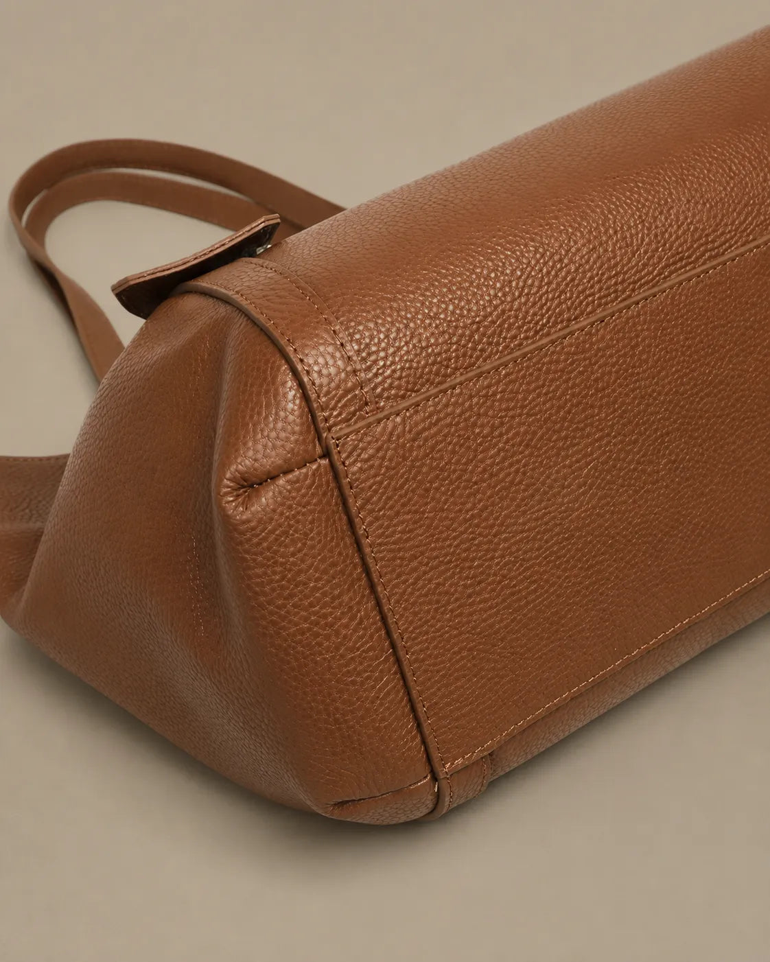 Bottom detail of The Viney genuine leather shoulder bag in Brown showing premium craftsmanship and reinforced base construction.