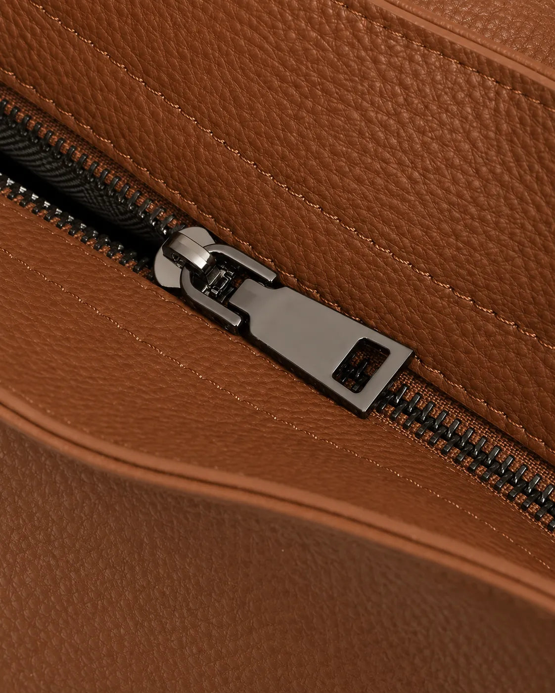 Close-up of The Viney genuine leather shoulder bag in Brown highlighting the premium metal zip closure and refined leather craftsmanship.