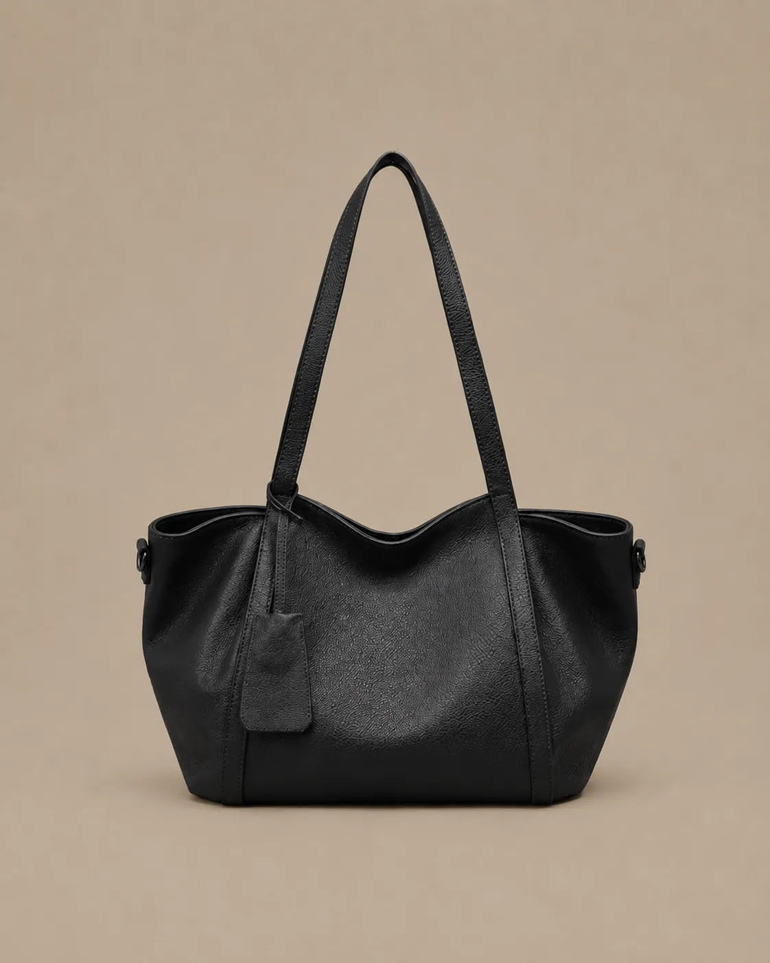 The Viney genuine leather shoulder bag in Black featuring a soft structured silhouette and spacious everyday design by Malena London.
