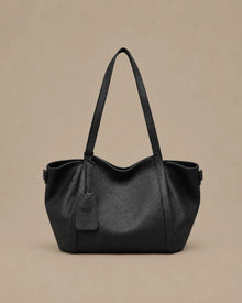 The Viney genuine leather shoulder bag in Black featuring a soft structured silhouette and spacious everyday design by Malena London.