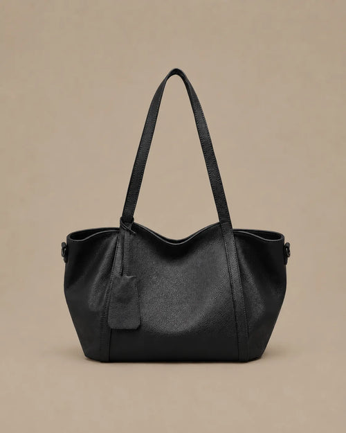 The Viney genuine leather shoulder bag in Black featuring a soft structured silhouette and spacious everyday design by Malena London.
