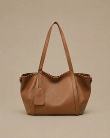 The Viney genuine leather shoulder bag in Brown featuring a soft structured silhouette and spacious everyday design by Malena London.