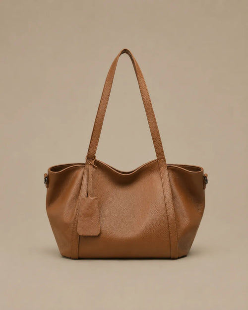 The Viney genuine leather shoulder bag in Brown featuring a soft structured silhouette and spacious everyday design by Malena London.