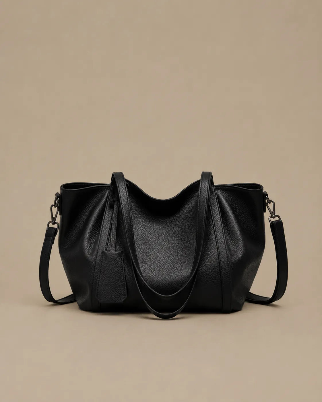 The Viney large genuine leather commuter bag in Black with shoulder handles and a detachable crossbody strap for versatile everyday wear.